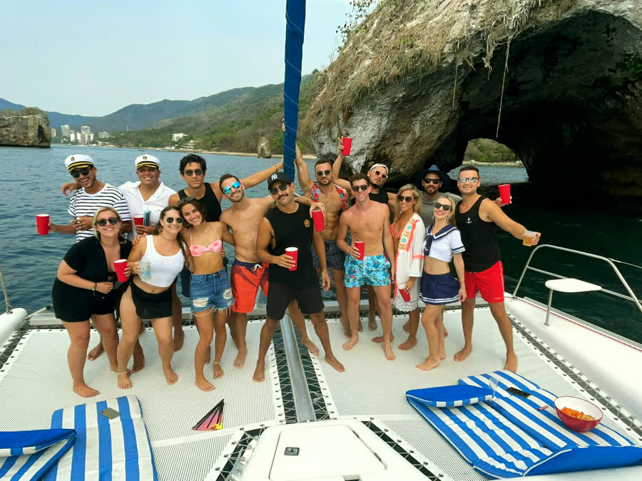 Guests on the bow with the Los Arcos rock formations behind
